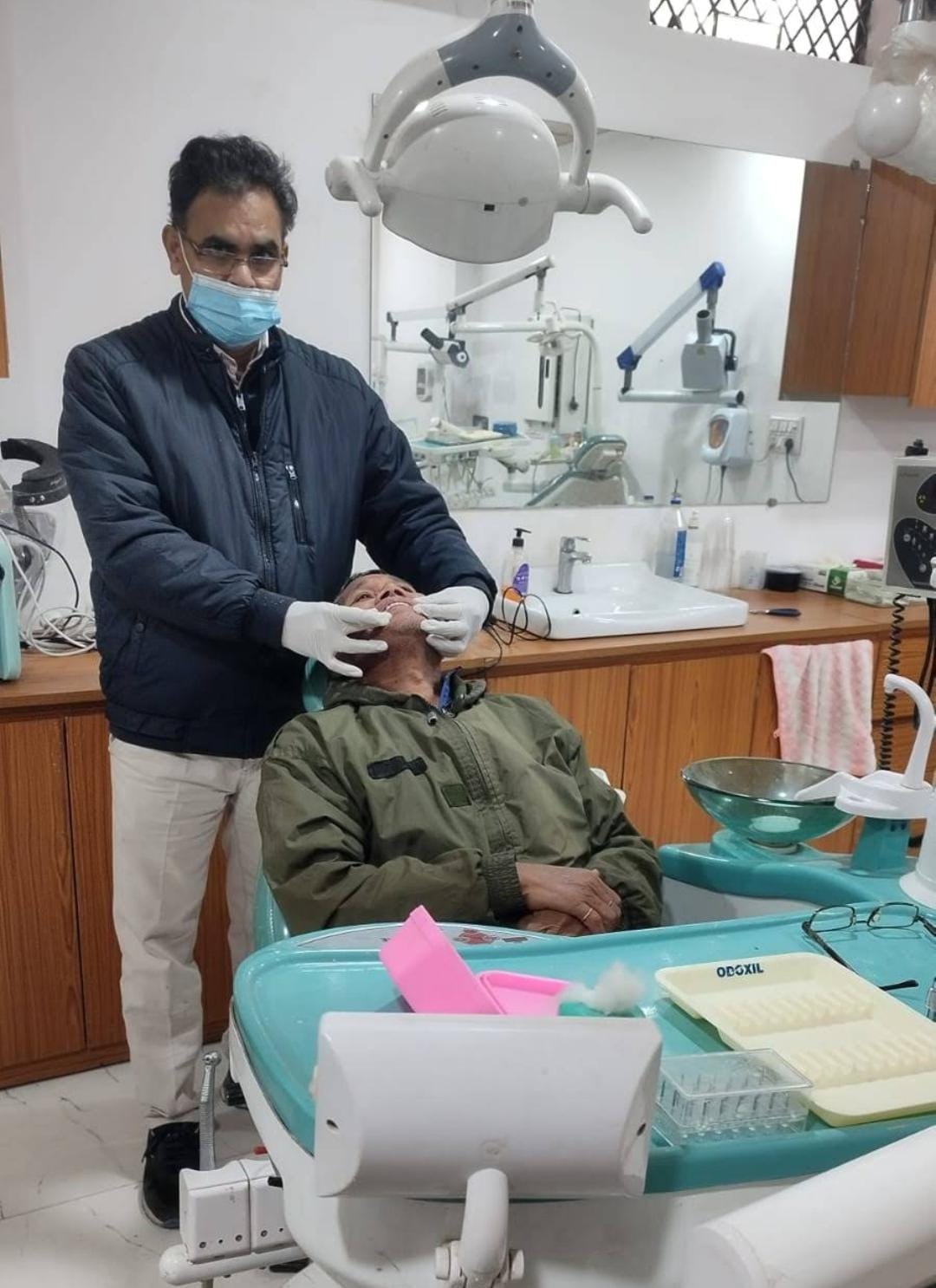 Dentist treating a patient at SAI Dental Clinic